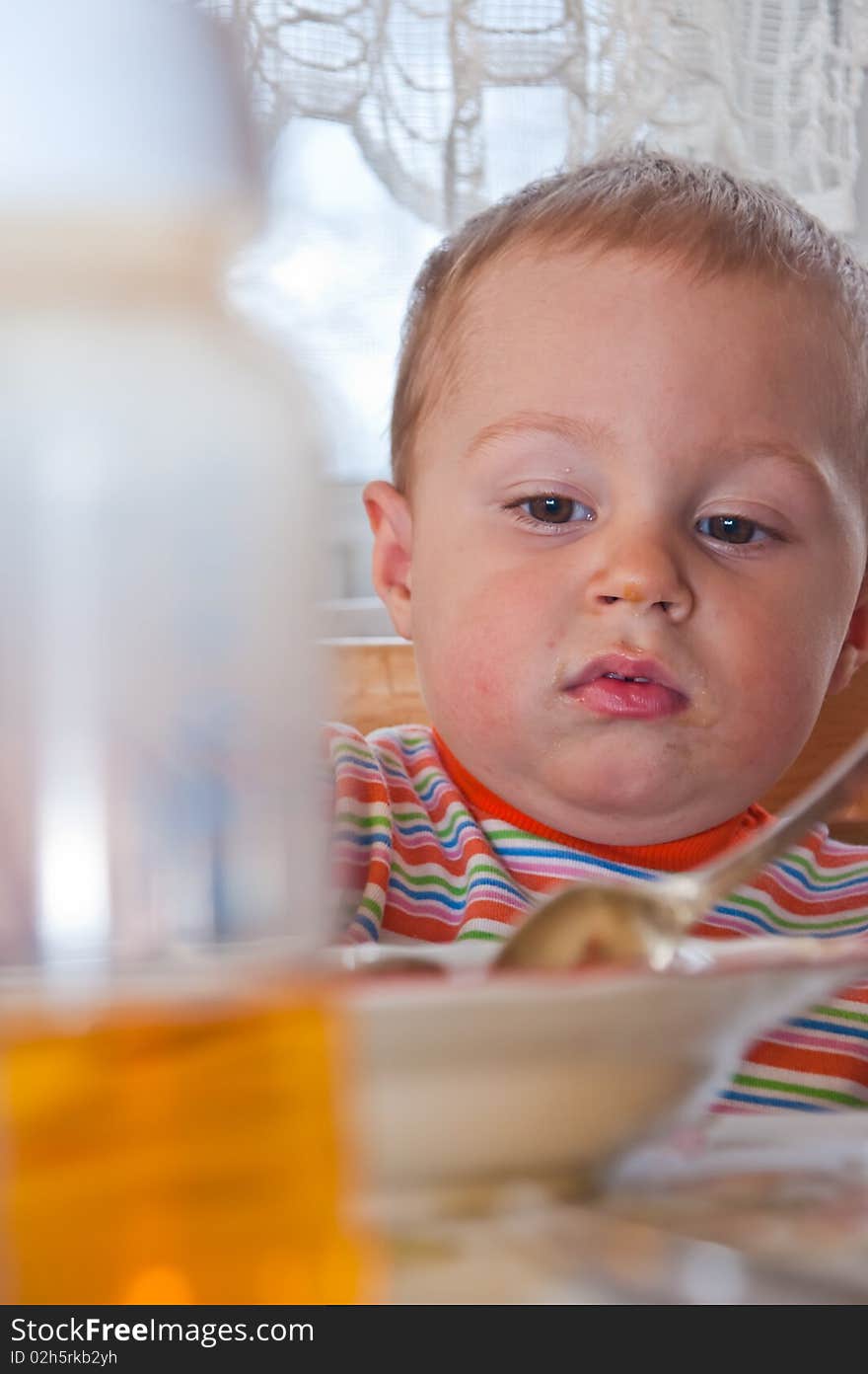 Young baby boy with bottle of juice, 2010