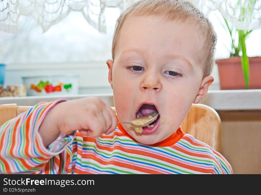 Young baby boy with spoon, 2010