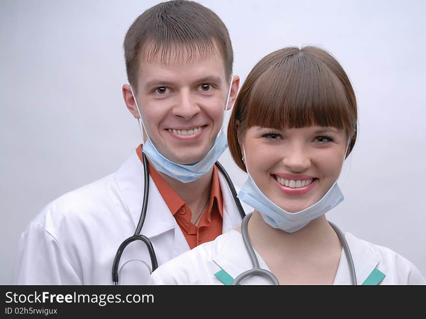 Portrait of two smiling doctors with phonendoscopes