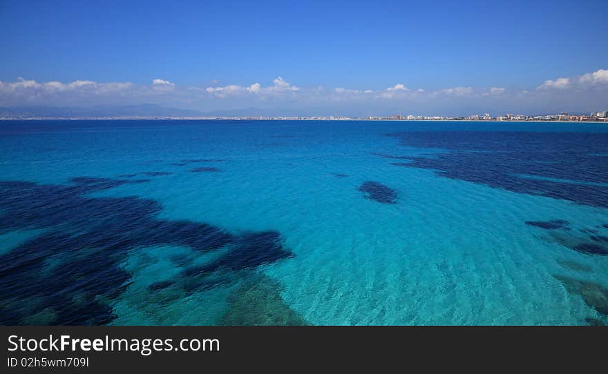 The perfectly beautiful blue waters of the Mediterranean Sea off the cost of the island of Majorca. The perfectly beautiful blue waters of the Mediterranean Sea off the cost of the island of Majorca.