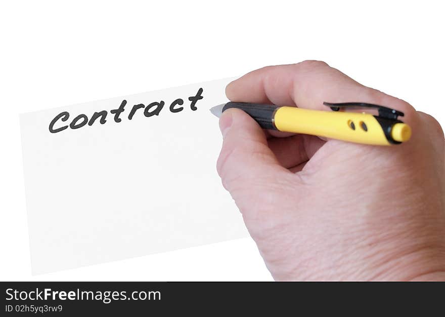 Sheet of paper with an inscription the Contract and a hand with a pen on a white background close up it is isolated. Sheet of paper with an inscription the Contract and a hand with a pen on a white background close up it is isolated