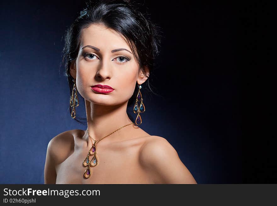 Portrait of elegant beautiful woman wearing jewelry.