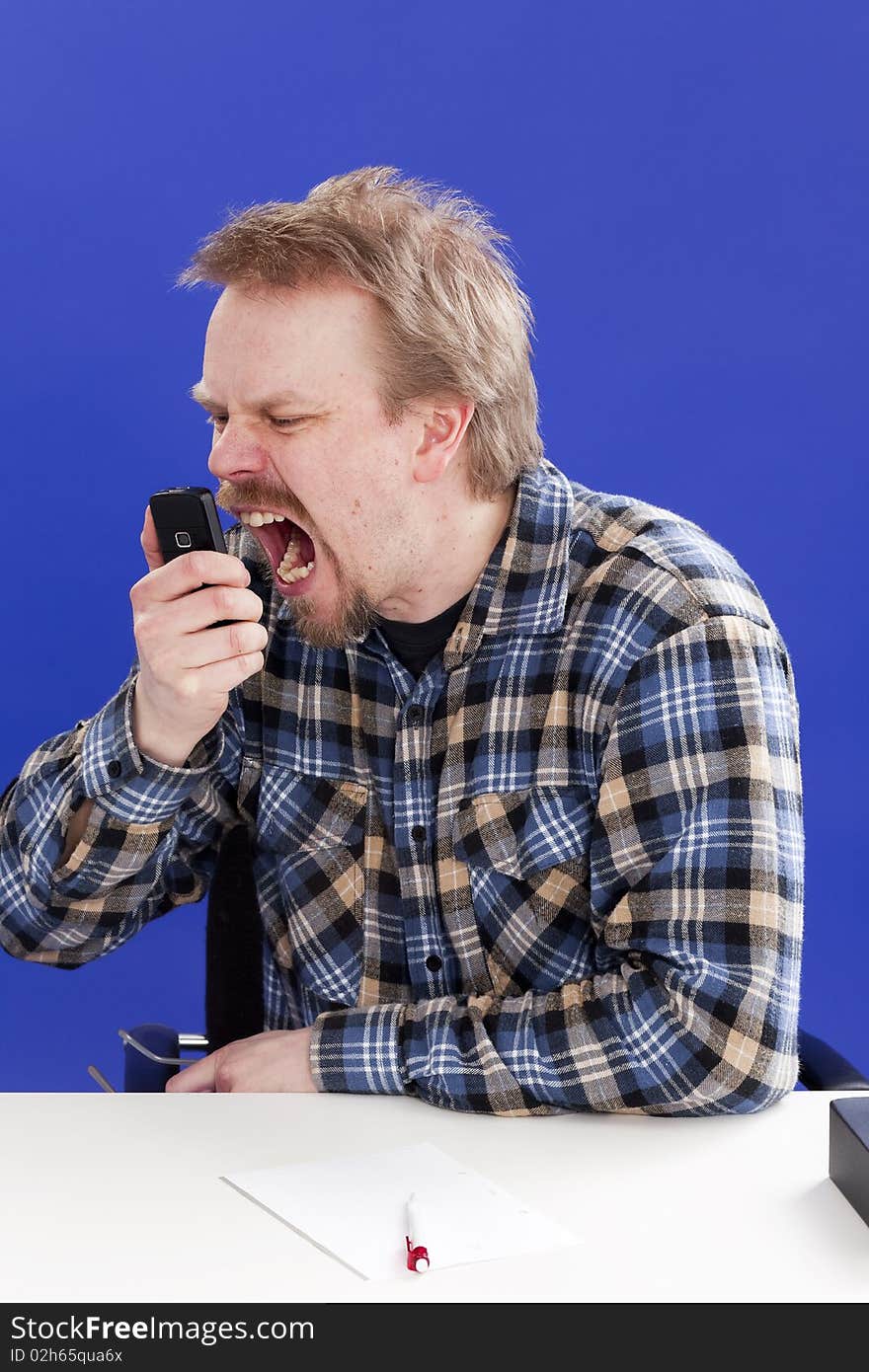 Man shouts on a phone