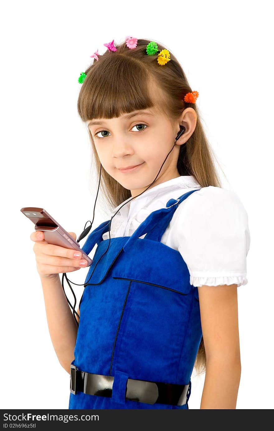 The girl in a dark blue dress holds a mobile. The girl in a dark blue dress holds a mobile