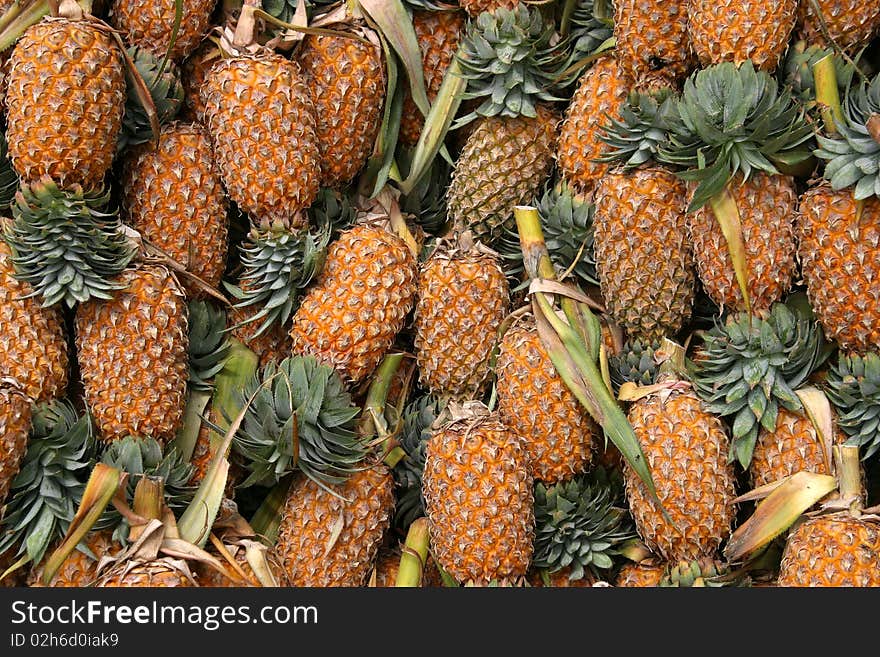 Pineapples in a market place