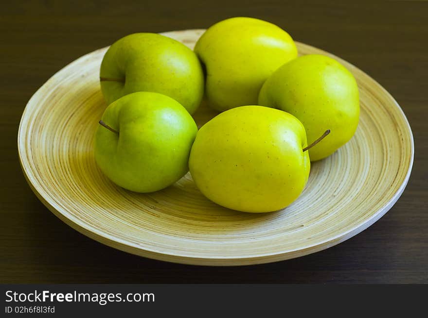 Green apple on a plate