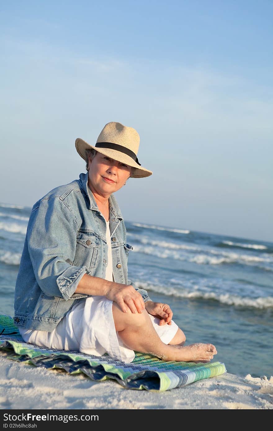 Mature Woman in Panama Hat at the Beach