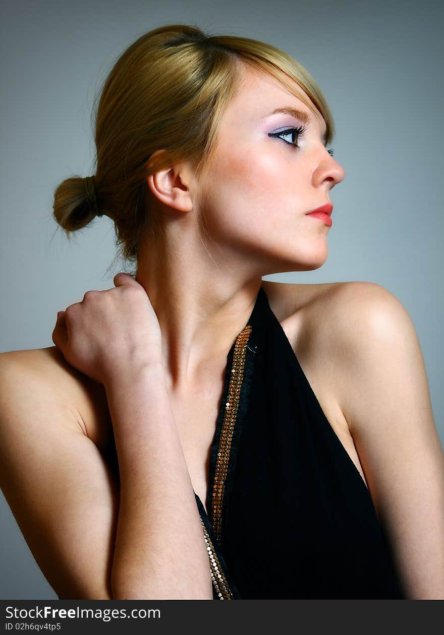 Young woman posing in black dress