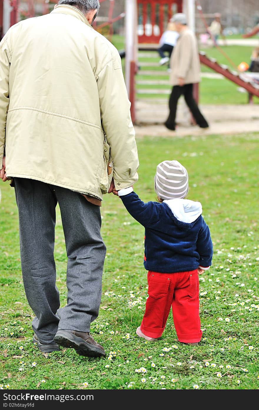 Parent with baby on park