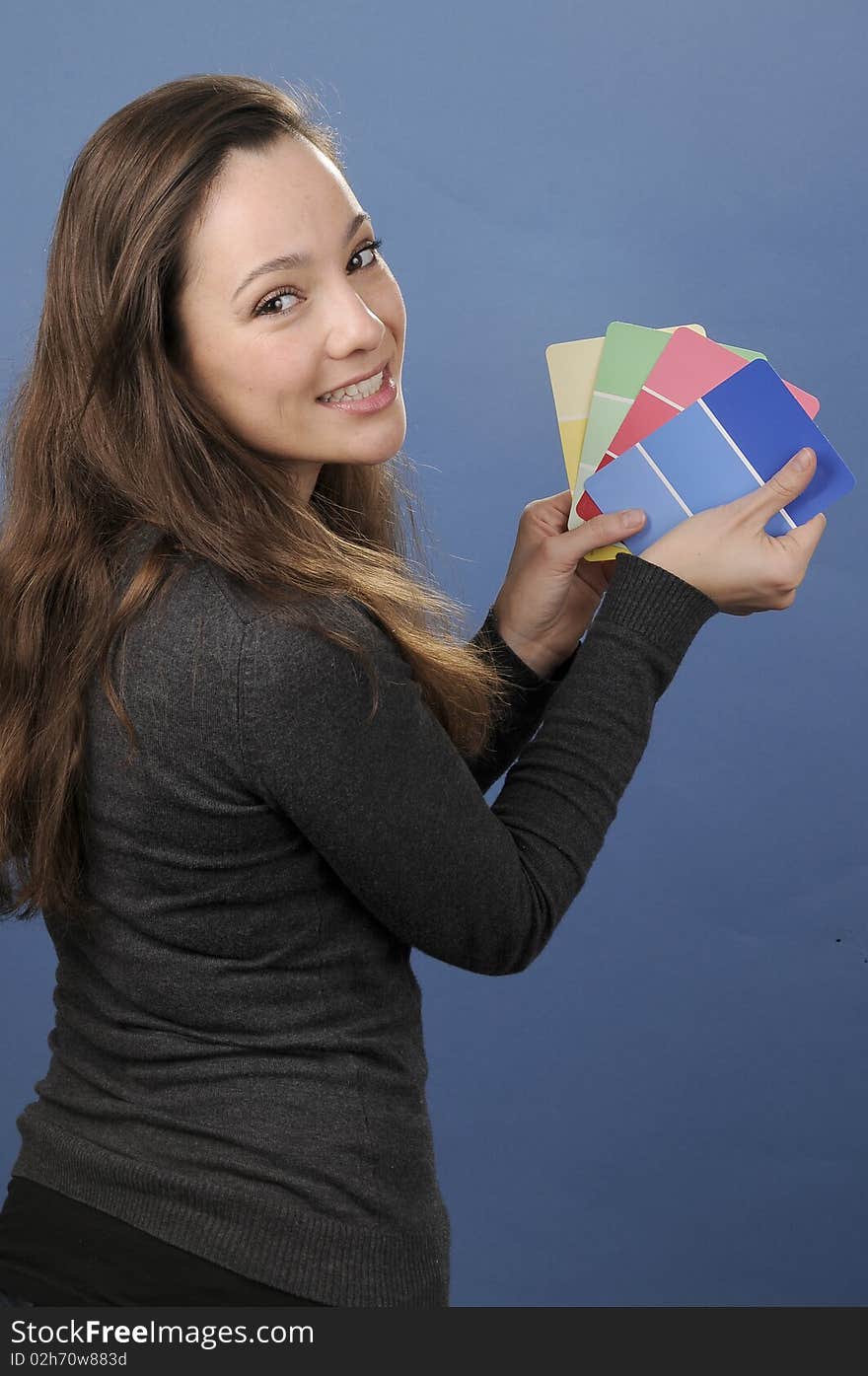 Young woman selecting the right color. Young woman selecting the right color