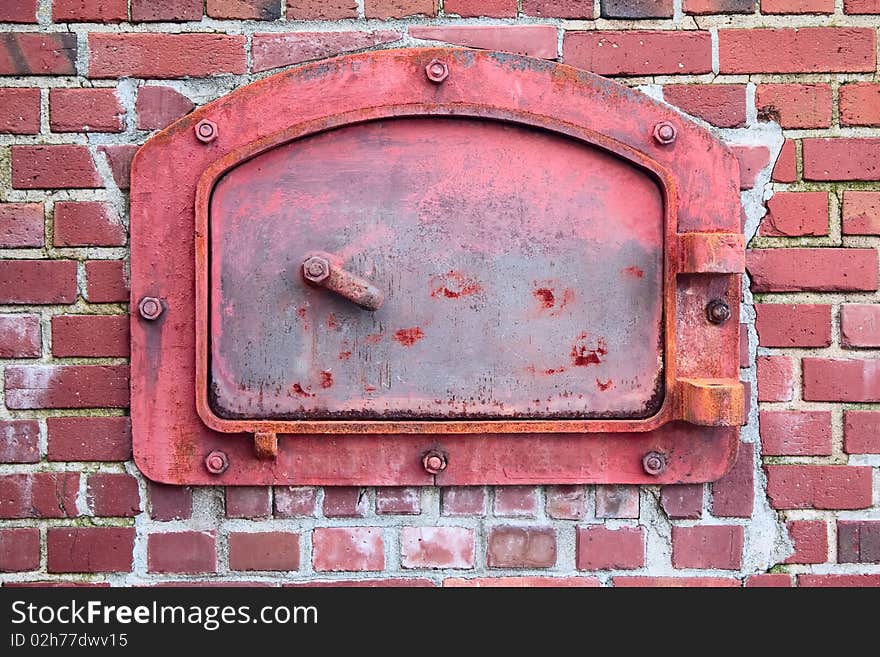 The old red door of the brick incinerator, from the turn of the 20th century. The old red door of the brick incinerator, from the turn of the 20th century.