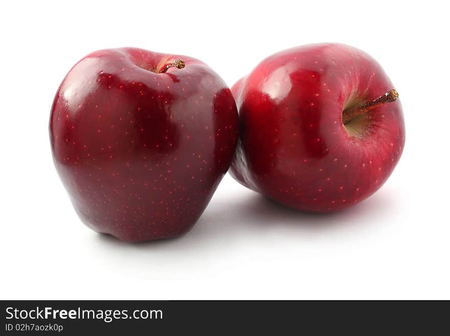 Two perfect red apples isolated on white background. Two perfect red apples isolated on white background.