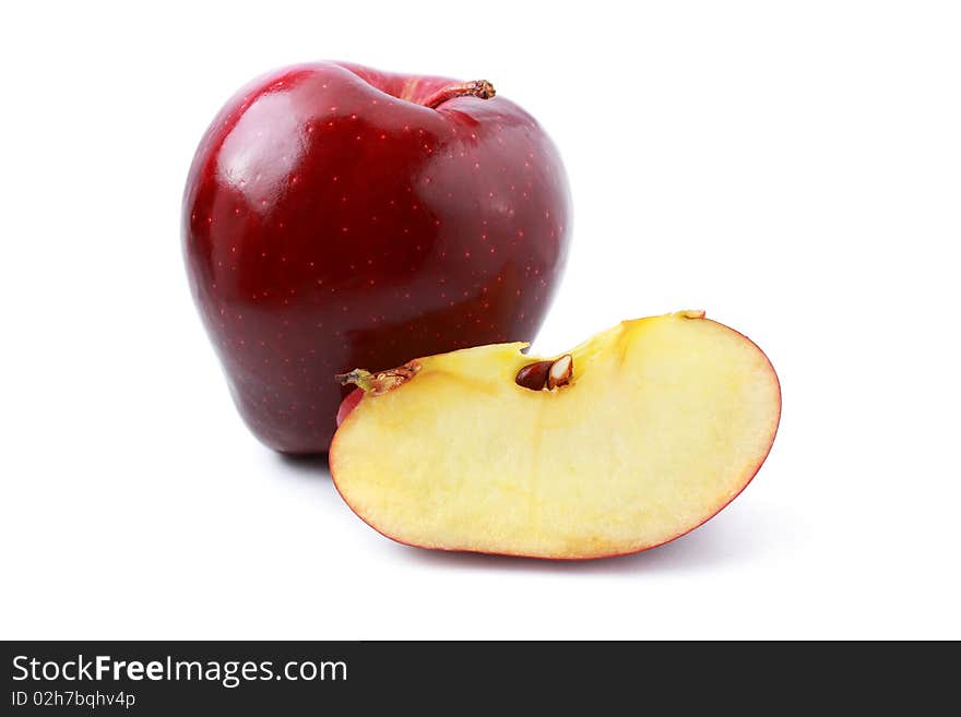 Close up of red apple with pieces isolated on white background.