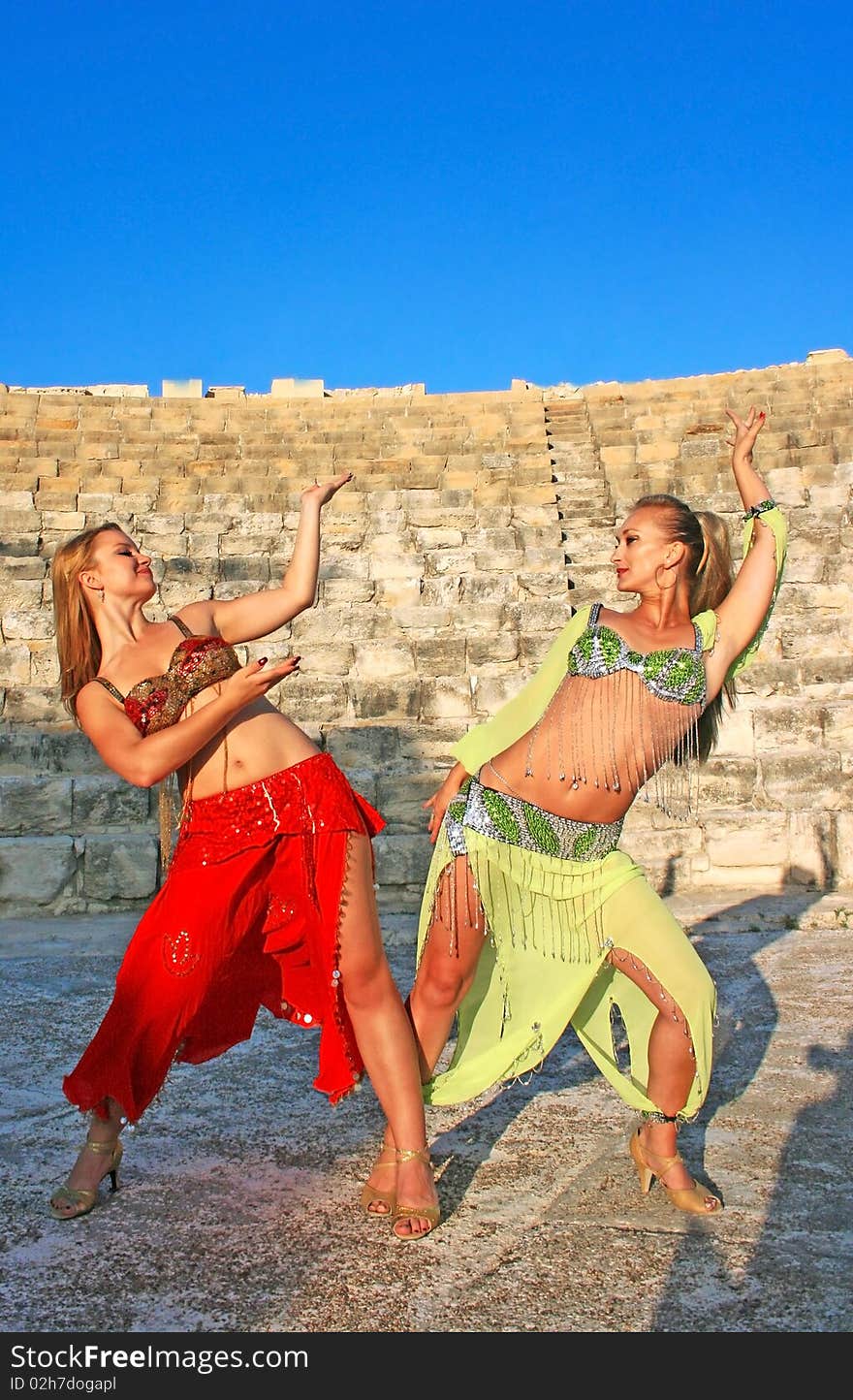 Beautiful belly dancers  on the ancient stairs of Kourion amphitheatre in Cyprus.