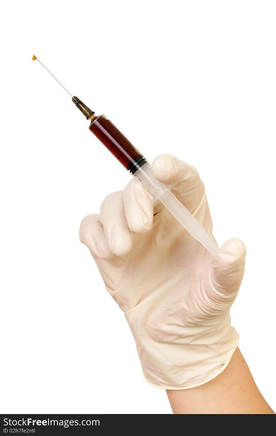 Hand with a syringe