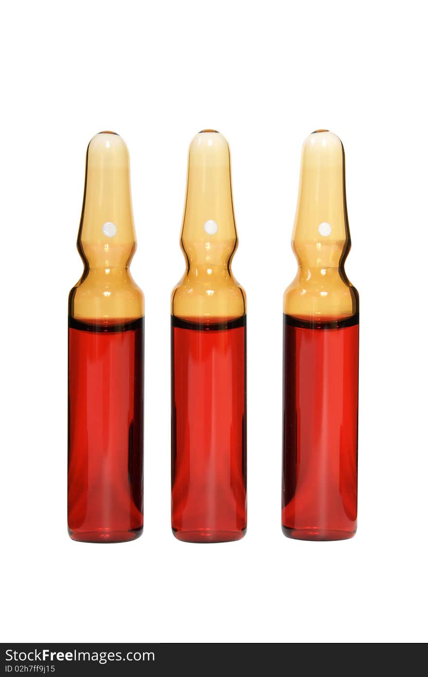 Red ampoules on a white background it is isolated