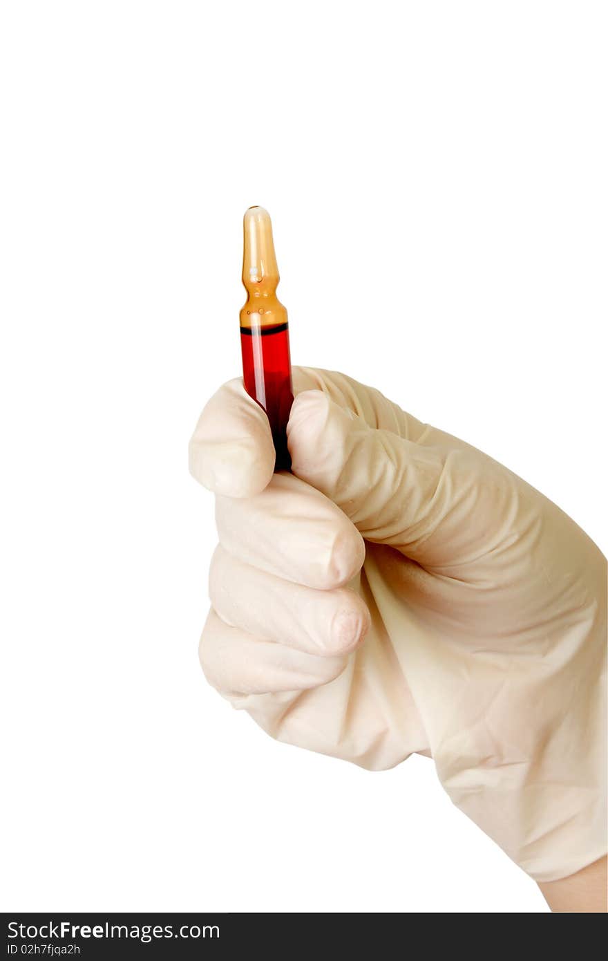 Hand with red ampule in a rubber glove it is isolated on white