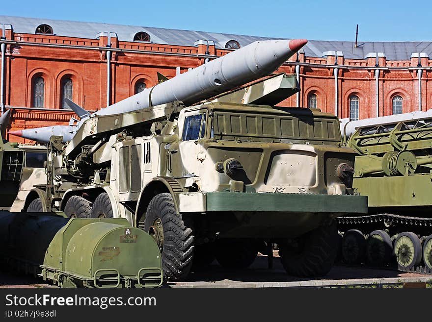 Rocket launcher truck near the old red building