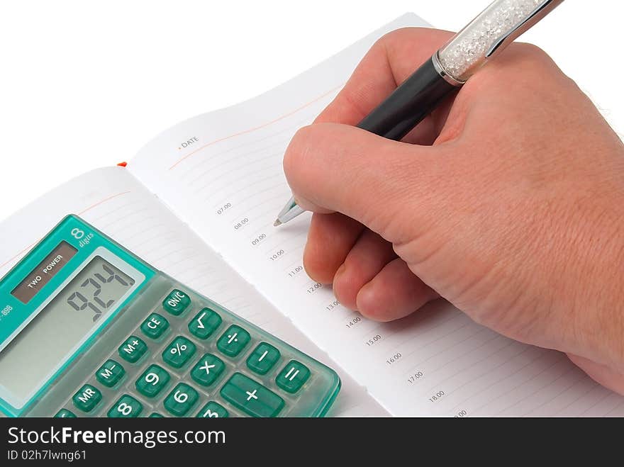 The calculator, organizer and the pen isolated on a white background