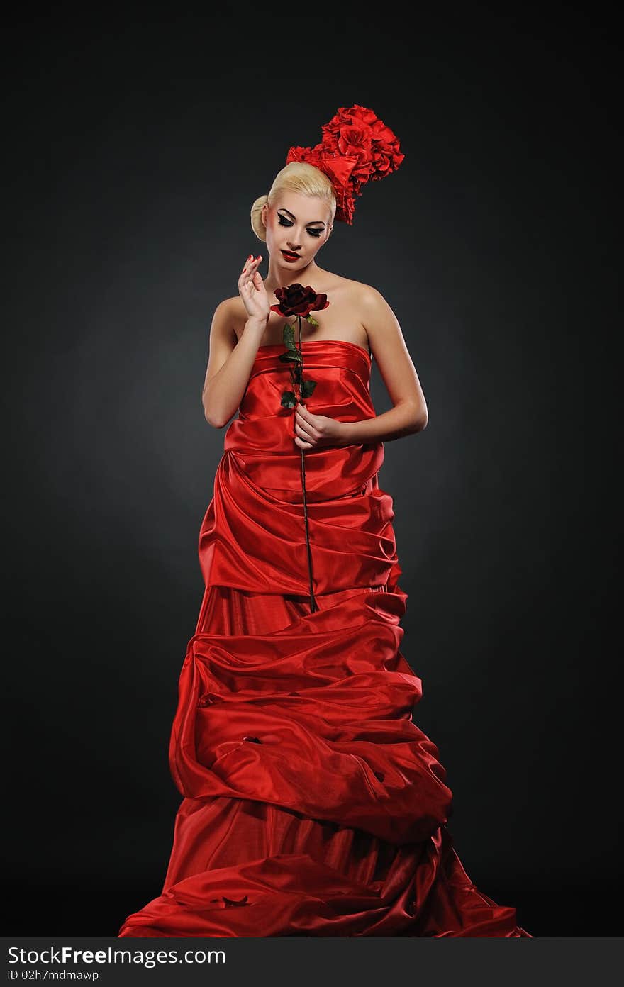 Beautiful lady with a red rose