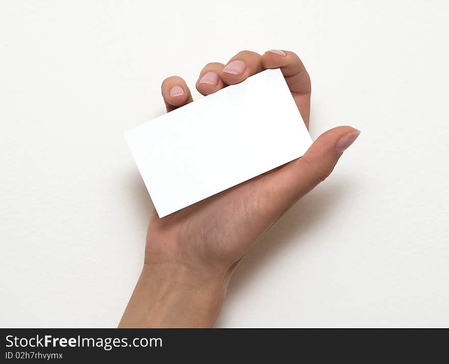 Hand holding an empty business card over white 1