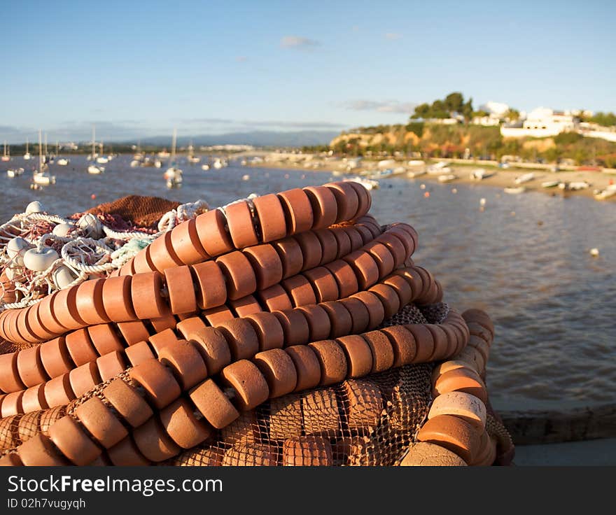 Fishing nets with Alvor in the background.