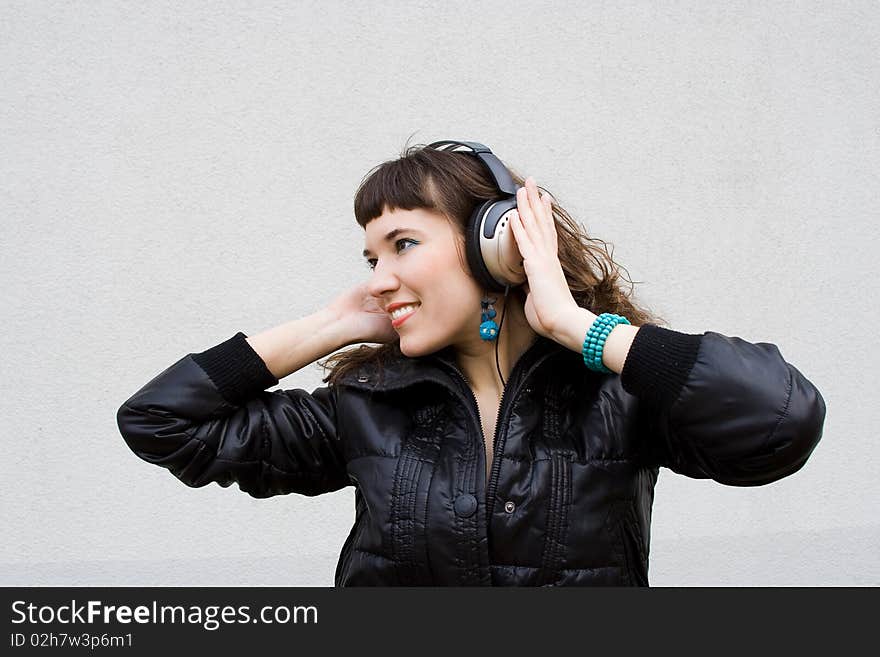 Beautiful girl listens a music