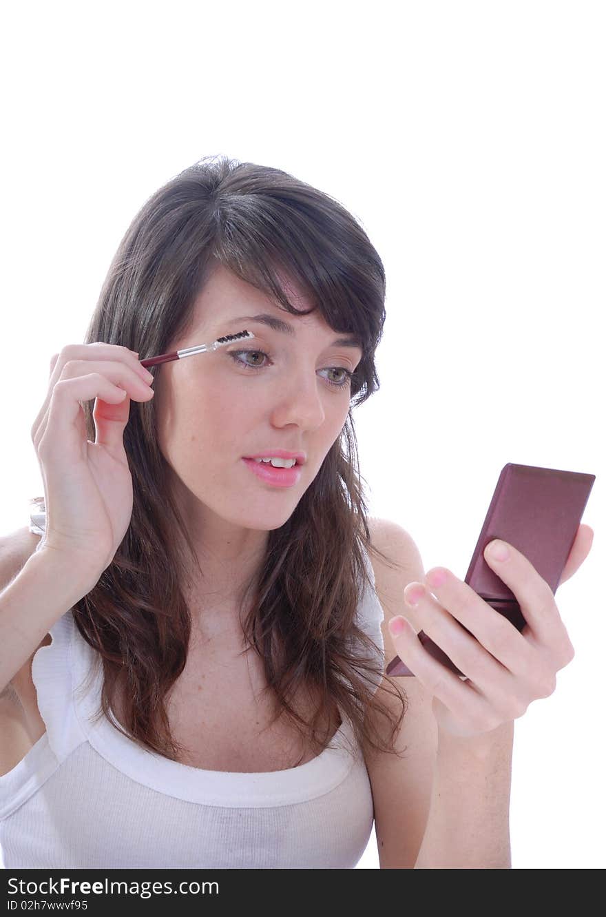 Young women applying make up