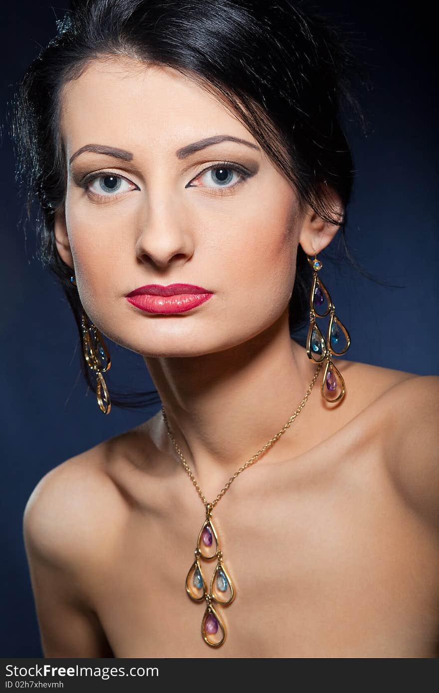 Portrait of elegant beautiful woman wearing jewelry.