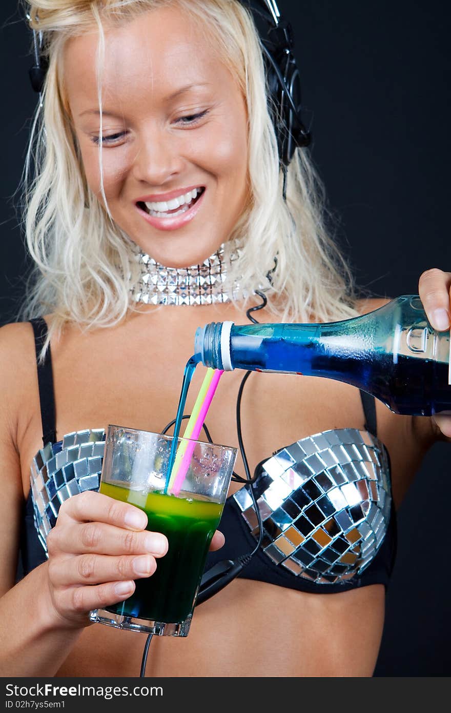 Cocktail and bottle in girls hands