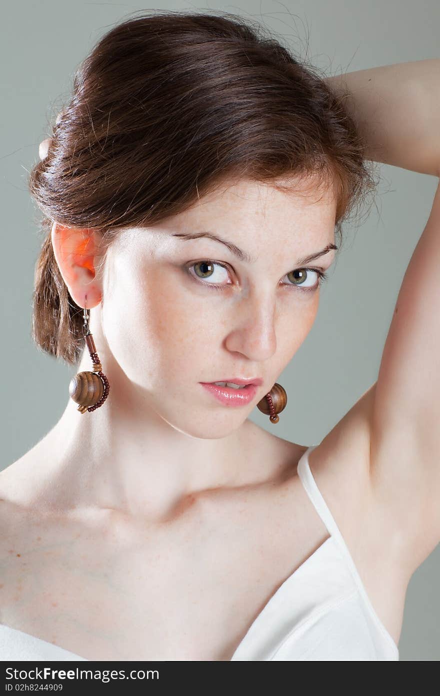 Close up of very girl on grey background. Close up of very girl on grey background