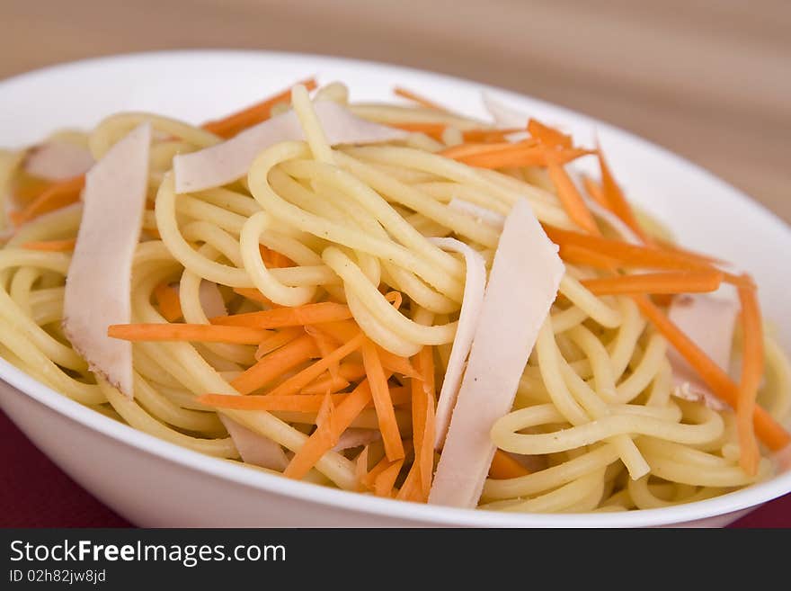 Pasta salad with carrot and meat