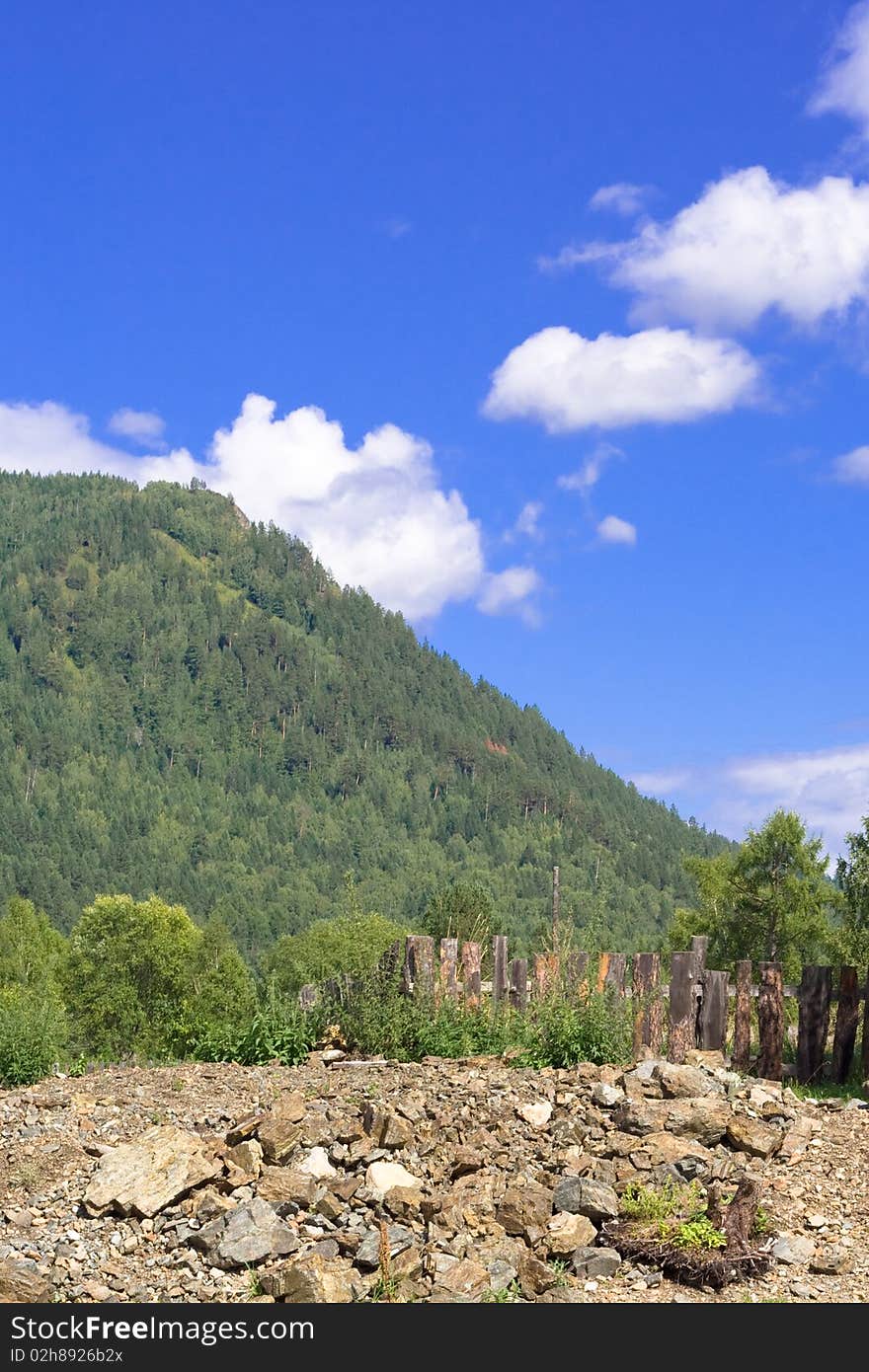 Mountain panorama: sky, rock, forest and village. Mountain panorama: sky, rock, forest and village