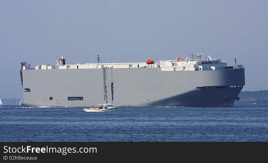 Small boat  and Tanker sailing in the ocean