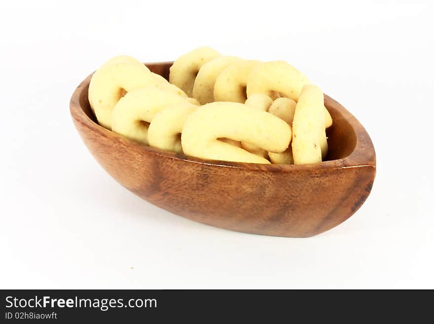 Homemade cakes with coconut meal in a bowl isolated on white