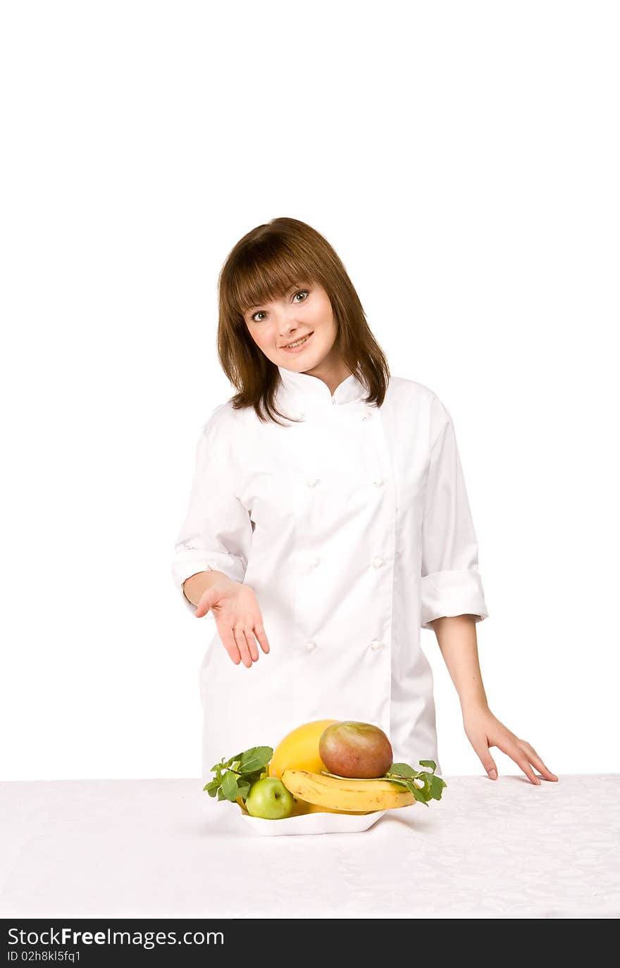 Girl cook shows fruit on white background