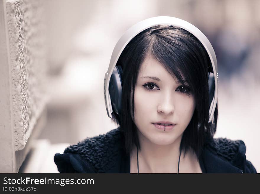 Young beautiful girl portrait wearing headphones. Young beautiful girl portrait wearing headphones.