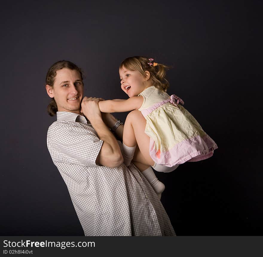 Father and little daughter playing. Father and little daughter playing