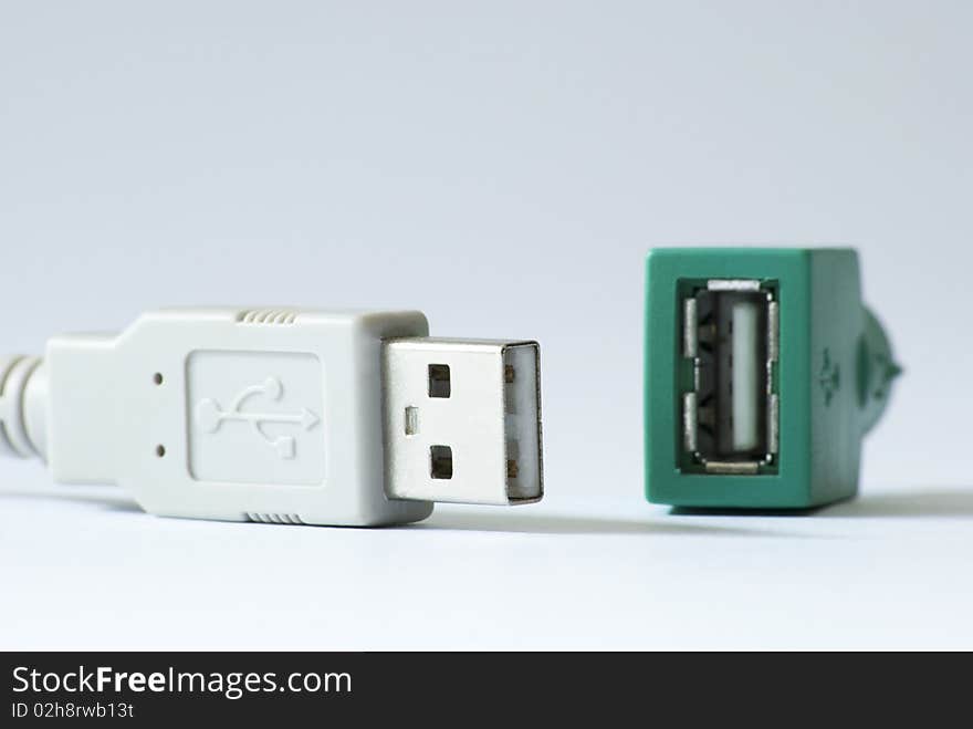 A white usb cable for connection and plug. A white usb cable for connection and plug