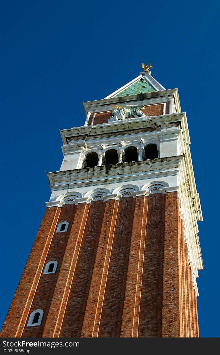 The San Marco's tower in Venice on a sunny afternoon. The San Marco's tower in Venice on a sunny afternoon