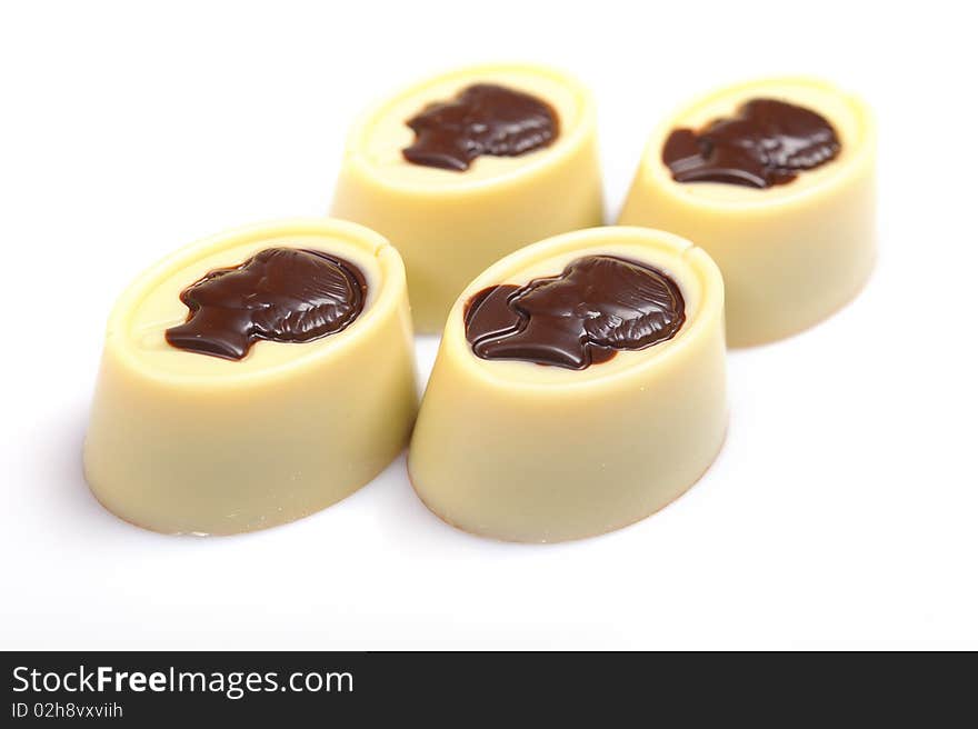 Delicious background of swiss dark chocolates, milk chocolates, pralines and truffles