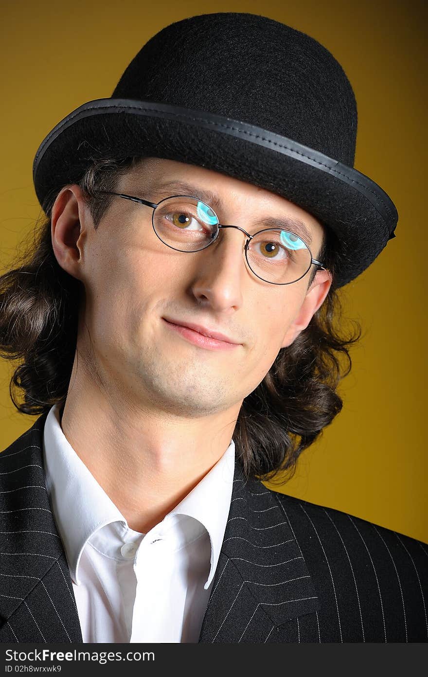 Close up retro portrait of young english gentleman in bowler hat and retro glasses. Close up retro portrait of young english gentleman in bowler hat and retro glasses