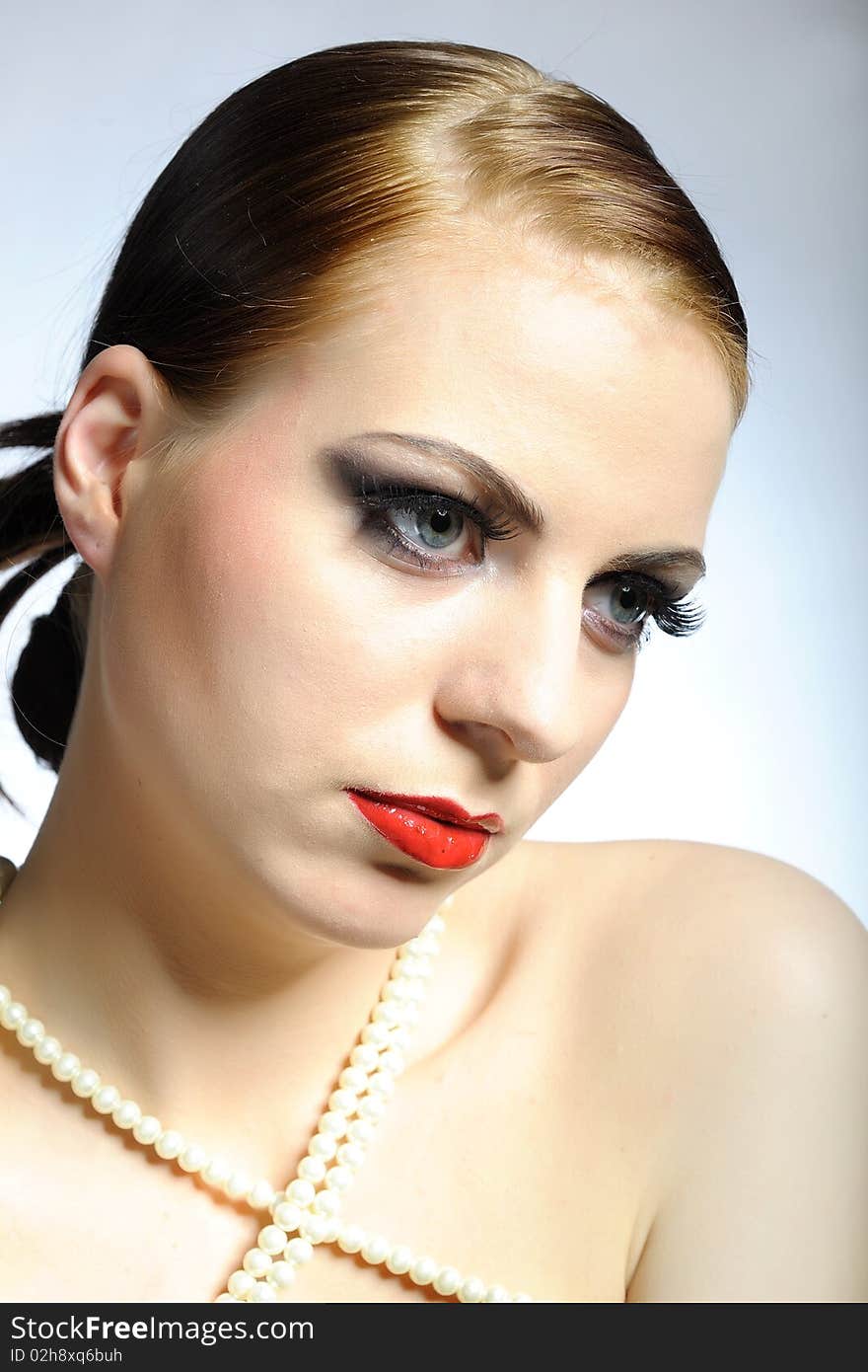 Beauty female face with red shiny lips