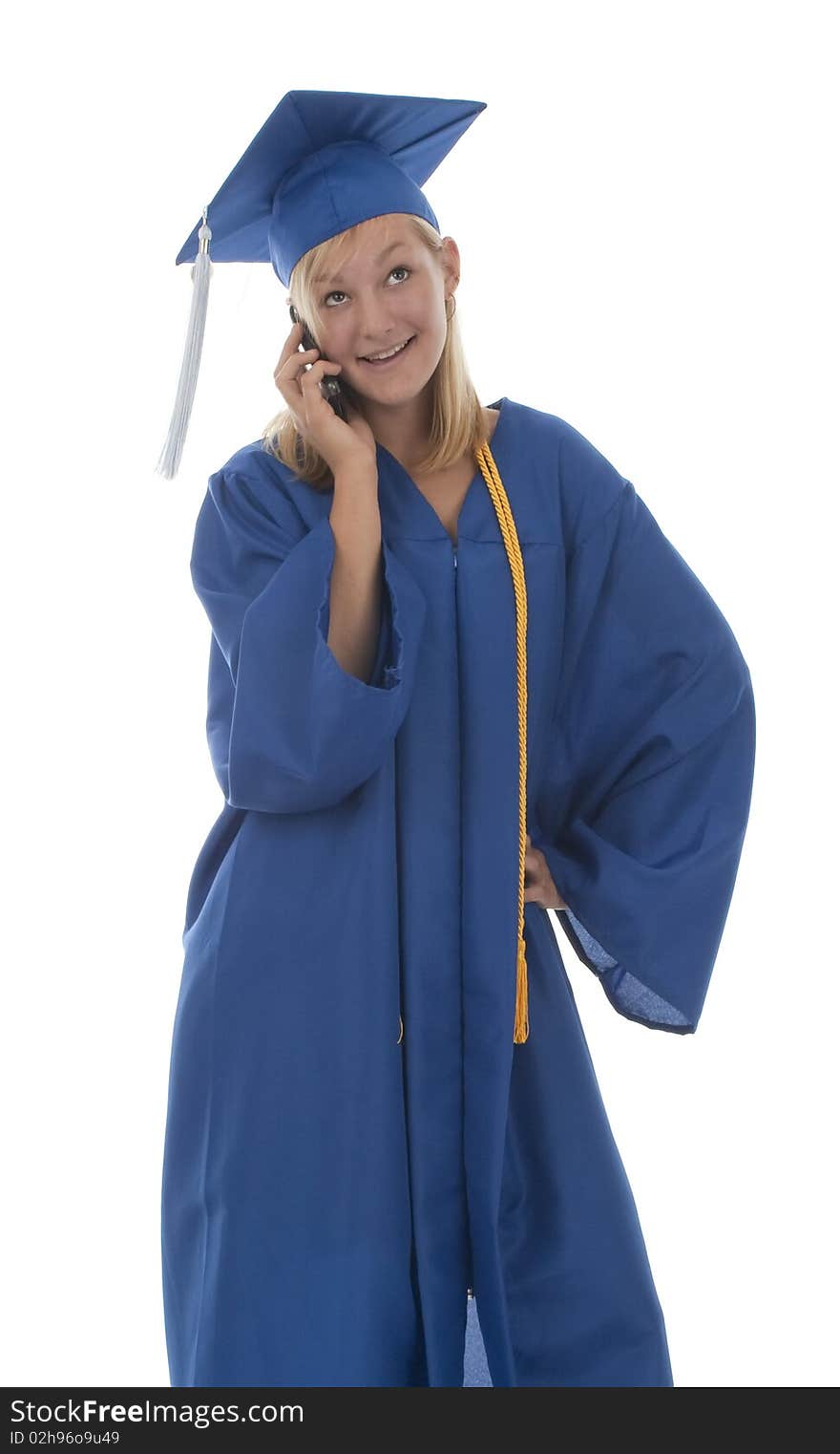 Happy pretty girl graduate in gown talking on mobile phone. Happy pretty girl graduate in gown talking on mobile phone