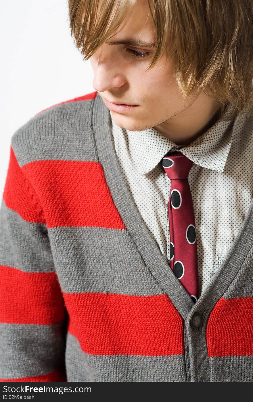 Waist up portrait of young man on light gray background