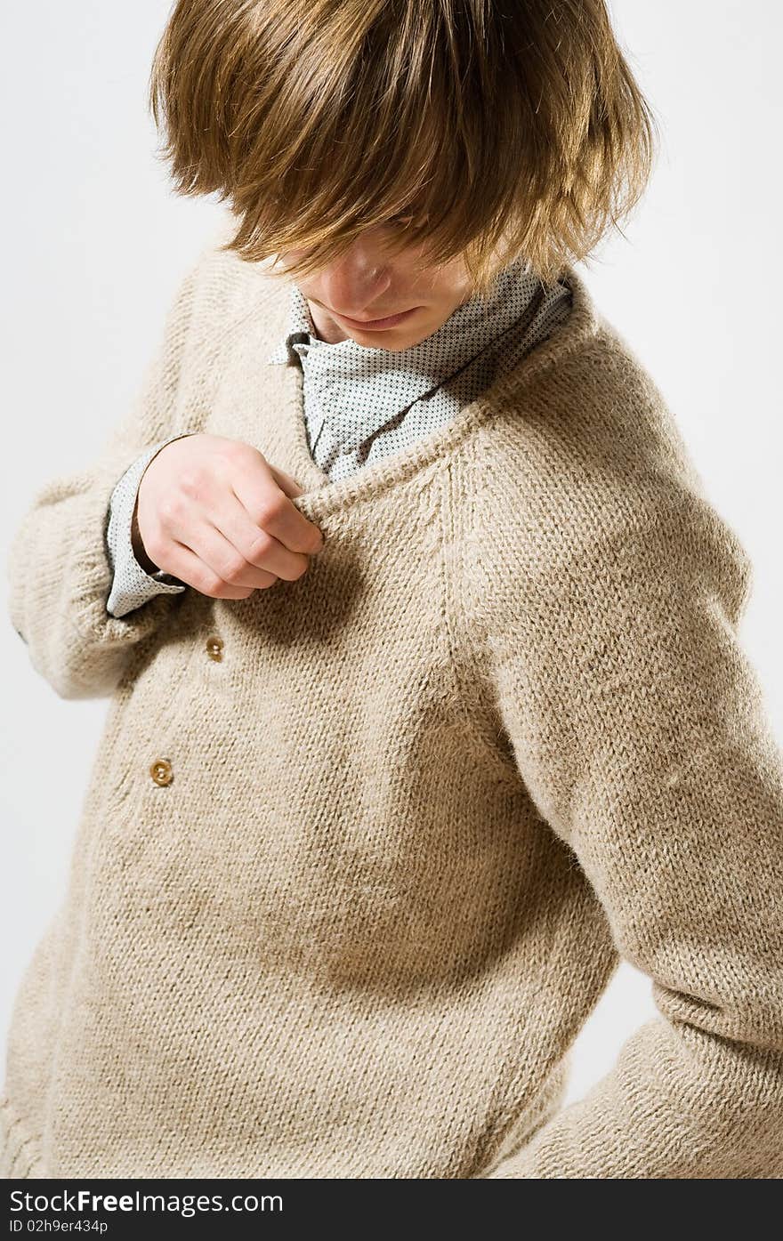 Waist up portrait of young man on light gray