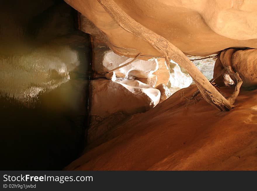 Deep waterhole under big rocks