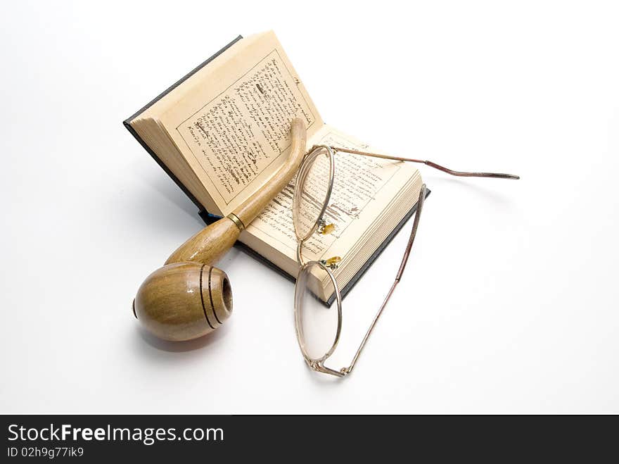 Brier, glasses and opened book. Brier, glasses and opened book