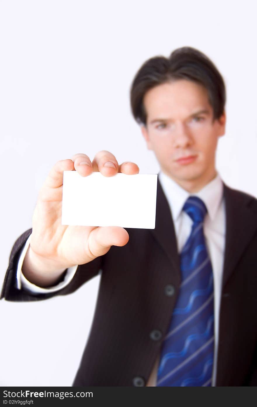 Business card conceptual image. Businessman holding a blank business card.