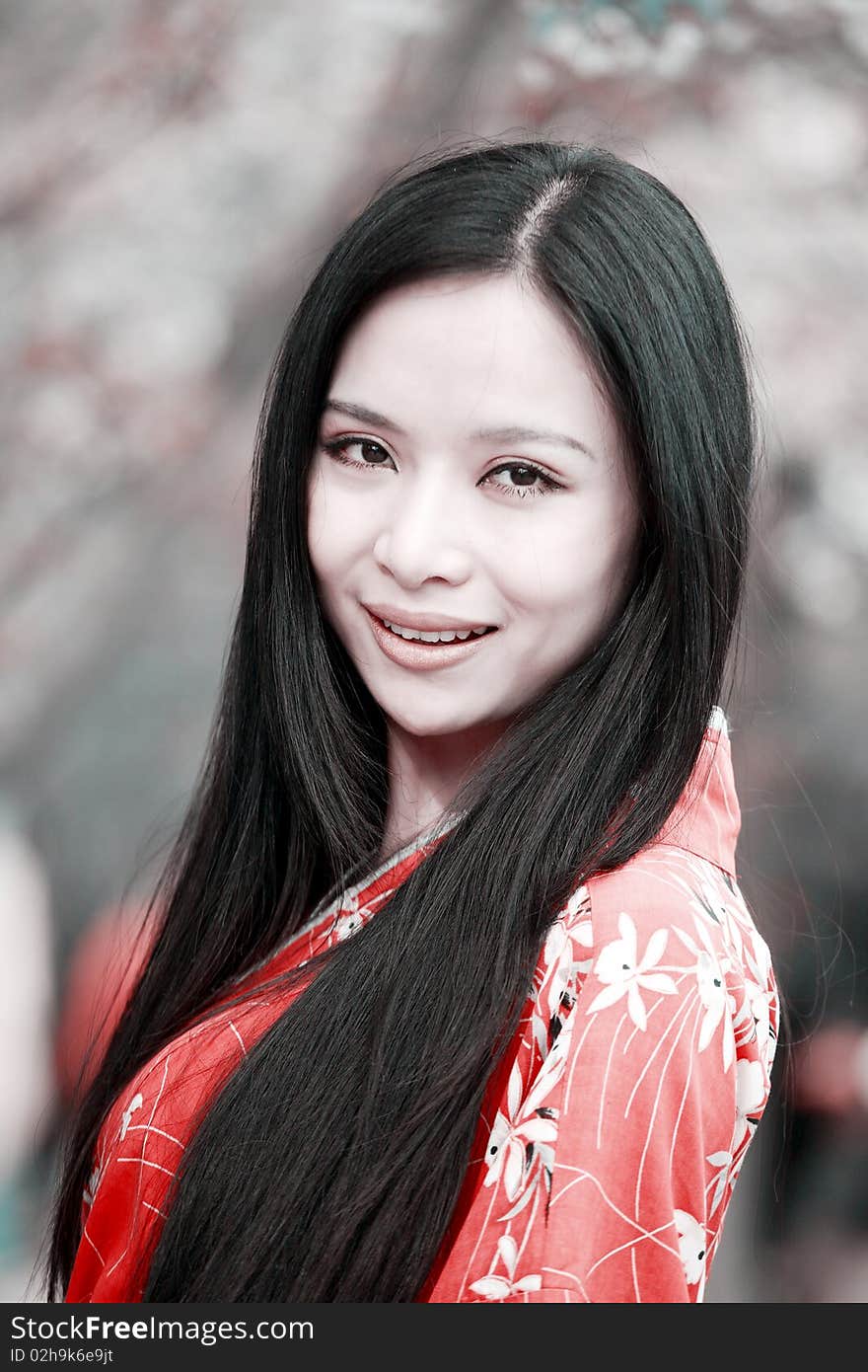 Beautiful Asian girl's portrait in cherry blossom season. Beautiful Asian girl's portrait in cherry blossom season.